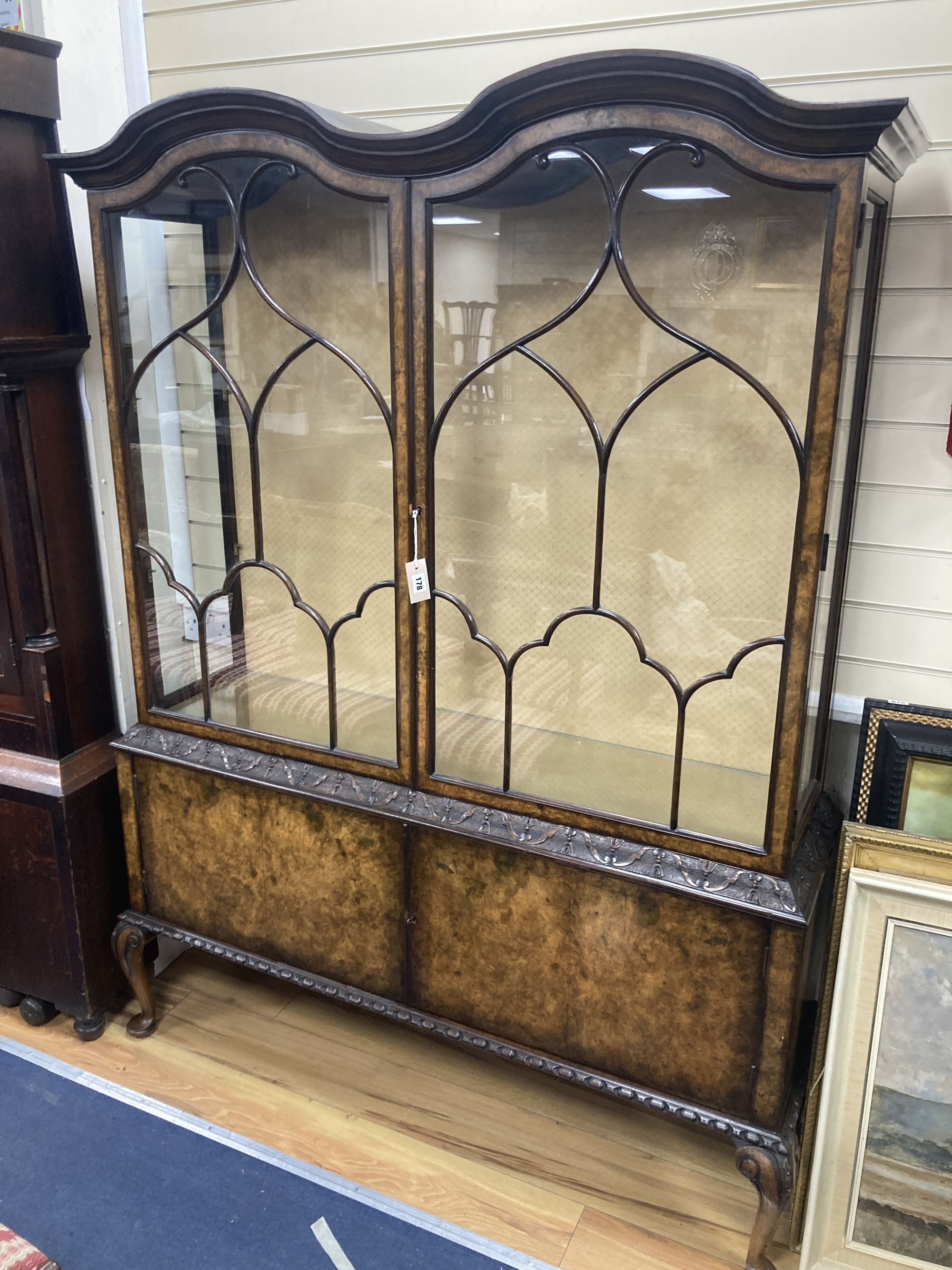 A Queen Anne revival burr walnut glazed china display cabinet, combined cupboard, length 136cm, depth 40cm, height 184cm